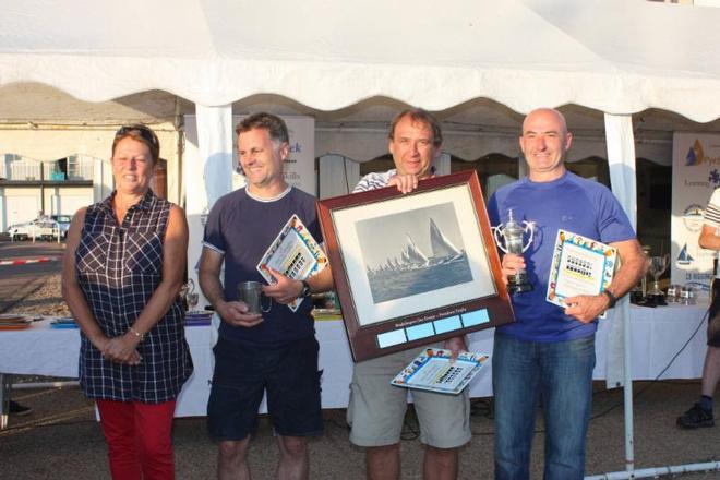 Sue Bouckley of Learning and Skills Solutions presents Clive Goodwin, Graham Sanderson and Mark Schofield with the Brightlingsea One Design Class trophies ©  Mandy Bines